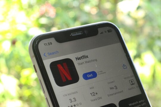 Batulicin, Tanah Bumbu Regency, Indonesia - November 13, 2024 : Apple iPhone 11 UI with Netflix App Display