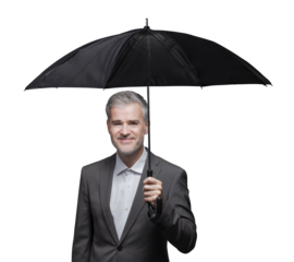 Businessman holding an umbrella and protecting himself from the rain