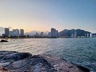 A large stone terrace on Hon Chong Beach, a check-in point along the Nha Trang Sea with the light at dusk, Vietnam.