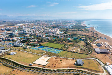 Gündoğdu holiday tourist region. Summer vacation on beach, Hotels sea, beach, coast, sports fields, water sports and sun. Drone Aerial view. Mediterranean,  Manavgat - Alanya – TURKEY
