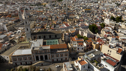 Fototapeta premium Aerial view of the church of San Francesco, with its high bell tower, and the city hall of Andria, in Puglia, Italy