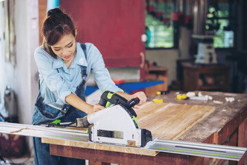 In a bustling carpenter's shop, a young woman craftsman expertly navigates her workshop, merging traditional woodwork skills with modern equipment to create hand-made furniture