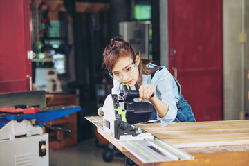 In a bustling carpenter's shop, a young woman craftsman expertly navigates her workshop, merging traditional woodwork skills with modern equipment to create hand-made furniture