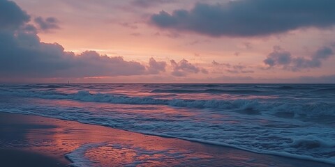 The North Sea looks dreamy at sunset, with calm waves and a peaceful horizon. This view is from Schiermonnikoog, a small island in the Netherlands.