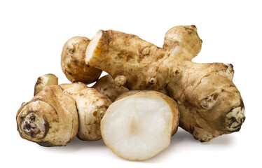 Jerusalem artichoke and a piece on a white background. Isolated