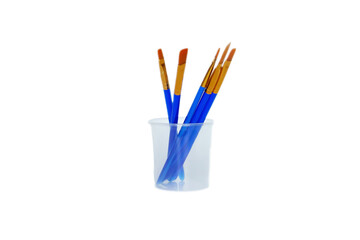 Many different paint brushes on white background