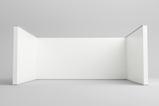 Minimalist white exhibition booth backdrop with side walls.