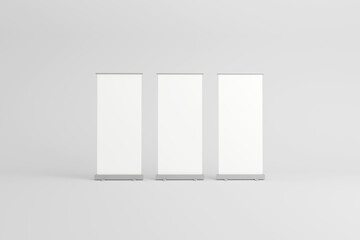Three blank roll-up banners for presentations and displays.
