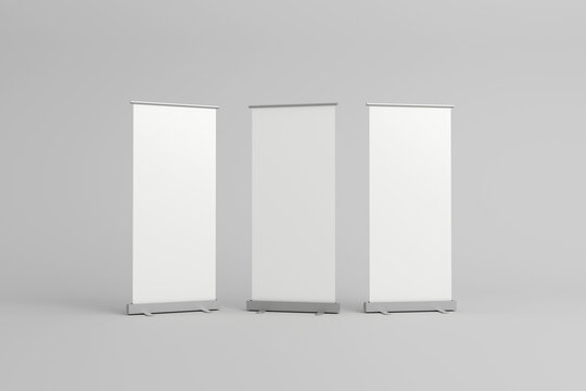 Three blank roll-up banners for presentations and displays.
