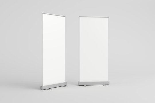 Empty white roll-up banners for presentations and exhibitions.