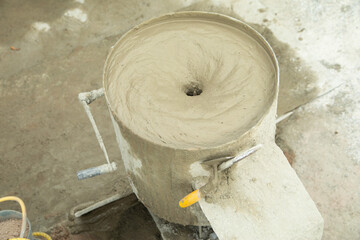 Concrete with cement mixer machine at construction site.