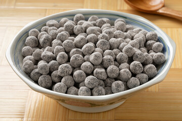 Bowl with uncooked black tapioca pearls close up