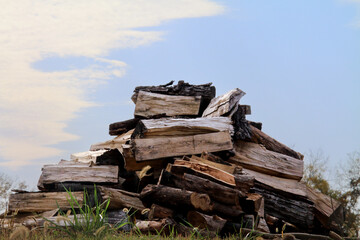 Stack of Firewood Against a Blue Autumn Sky