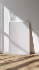 Blank Canvas Frame on Wooden Floor Minimalist Design, White Frame Mockup Sitting on Wooden Floor with White Wall