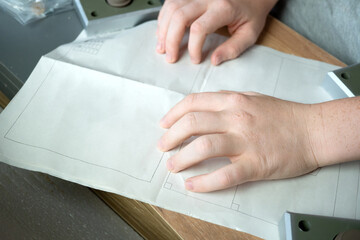 teenager assembles furniture according to instructions