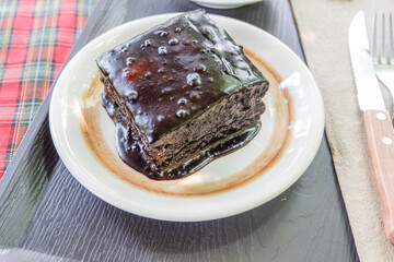 Homemade dark chocolate fudge brownies cake,Traditional French sweet dessert in forest,Delicious Homemade pastries,selective focus.