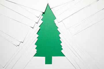 Paper cut Christmas Tree, Christmas card made of overlapping white paper sheets