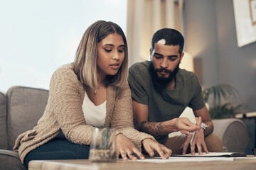 Home, couple and reading with legal documents for mortgage or loan agreement on sofa. Apartment,...