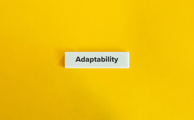 Adaptability Word. Text on Letter Tile on Yellow Background. Minimal Aesthetic.