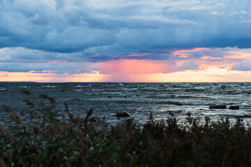 Weather. Storm in the Baltic Sea during sunset view from the shore. Nature of Estonia.