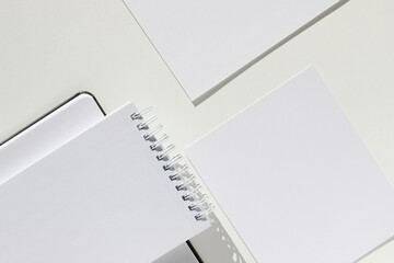 Office Desk Flatlay of Blank Spiral Notebook Paper Sheet With Copy Space, Agenda Notebook, Cards,...