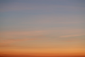 The dramatic colors of the sunset in the sky gradient from blue to orange.
