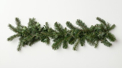 Straight arrangement of a Christmas pine garland with natural fir branches against a white background, capturing a festive, minimalist feel