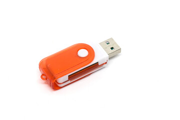 Close-up of an orange USB flash drive on a white background, ideal for data storage, file transfer, and portable media applications.
