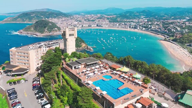 Flying over monte Igueldo Tower in San Sebastian city, Basque country, Spain