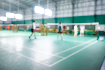 Obraz premium badminton court with burred players badminton
