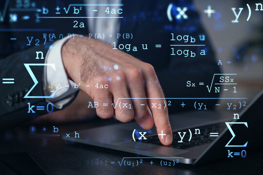 Hand pointing to a laptop keyboard with mathematical formulas overlayed on the screen.