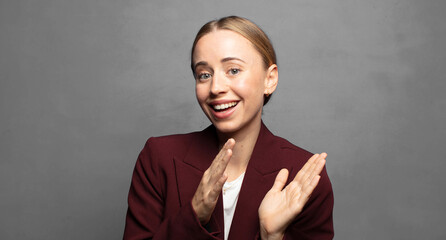 feeling happy and successful, smiling and clapping hands, saying congratulations with an applause