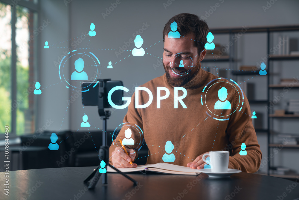 Poster man writing in notebook with gdpr and hologram icons of people around on a digital interface.