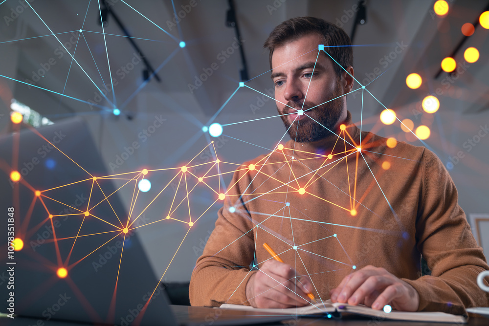 Poster man working on laptop with digital network overlay, writing in notepad on blurred background.