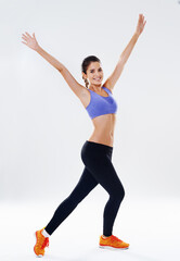 Woman, fitness and happy with arms open in studio on portrait with white background on break and isolated. Female person, smile and confident for exercise, training and workout for health or wellness