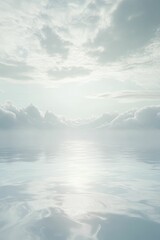 Obraz premium White clouds over a calm, blue ocean.