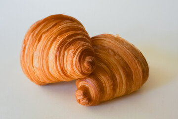 Two french Delicious croissants isolated. Freshly baked pastries