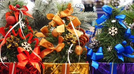 Colorful Christmas gifts boxes decorated with bows and snowflakes 