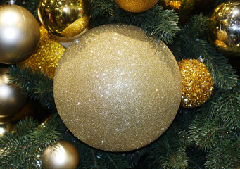 Christmas tree with golden balls close-up.