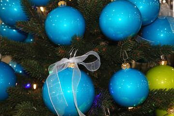 Shiny blue balls on the Christmas tree.