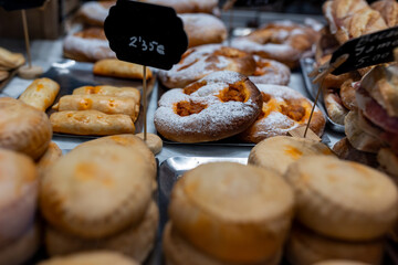 Traditional sweets of Menorca, including cheese pastry, ensaimada, and duquesitas
