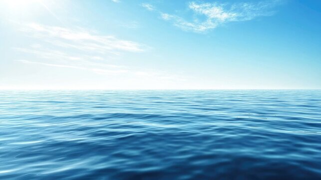 Vast expanse of blue ocean water on a sunny day with clear horizon and white clouds in sky.
