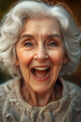 Portrait of a cheerful elderly woman smiling warmly