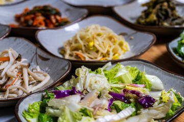various Korean side dishes on the table