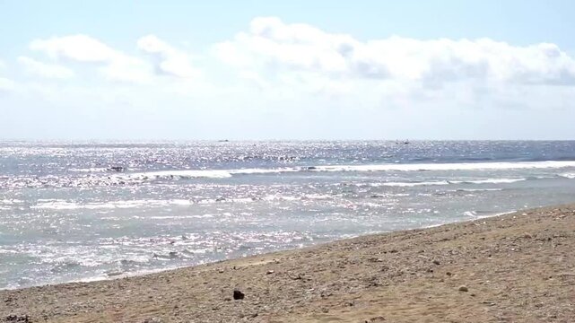Ujung Genteng Beach view, Sukabumi. Visitors are enjoying the sea view with white sand.