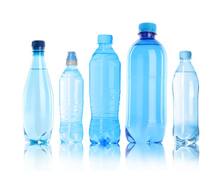 Different plastic bottles with water on white background
