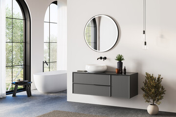Modern bathroom interior with white bathtub and chic vanity, white walls, concrete floor, arches,...