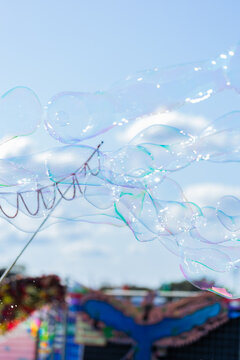 Bubbles in blue sky at cultural festival