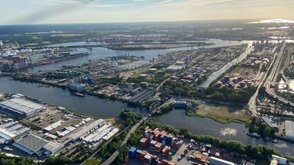 Aerial View of Industrial Port City with Waterways and Containers