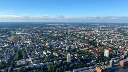 Aerial View of Urban Cityscape with Greenery and Blue Sky